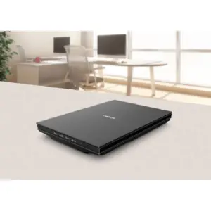 Canon CanoScan LiDE 300 scanner closed on an office desk