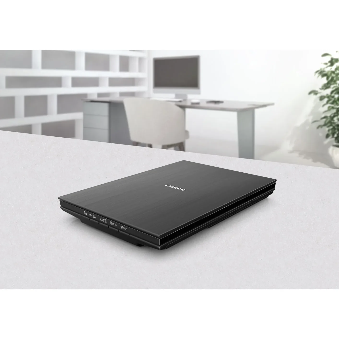 Canon CanoScan LiDE 400 scanner closed on an office desk