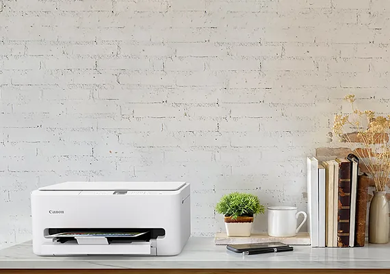 Direct view of Canon PIXMA TS5570 printer body against a clean white studio background.