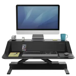 Fellowes 0007901 Lotus black sit-stand workstation with monitor, keyboard and desk accessories shown for illustration