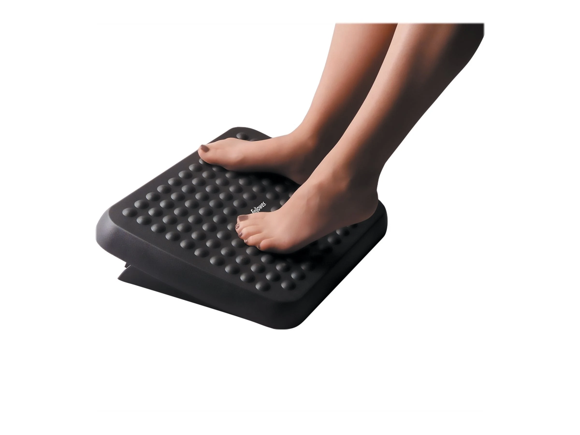 Fellowes 48121 Standard Footrest shown in use with feet on textured platform
