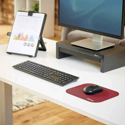 Fellowes red mouse pad on an office desk