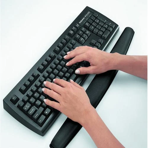 Fellowes Memory Foam Keyboard Wrist Support 9178201 shown in use with a keyboard
