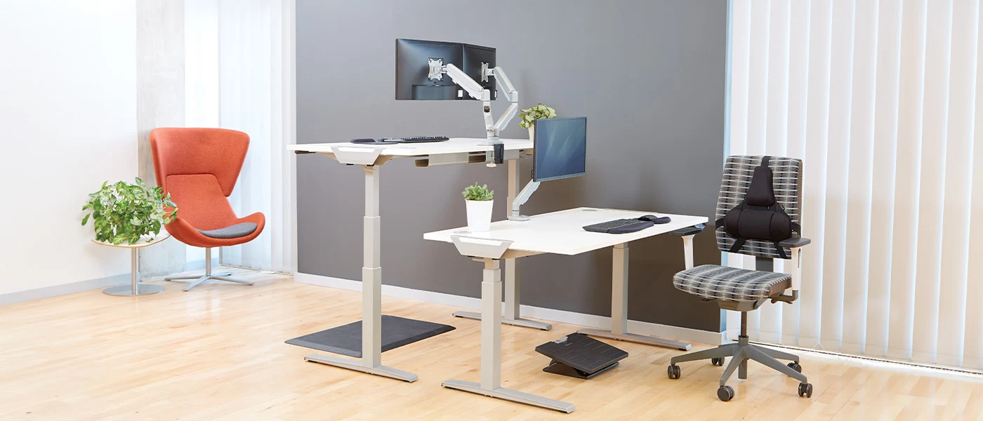 Office workstations using Fellowes Levado silver height adjustable desk bases
